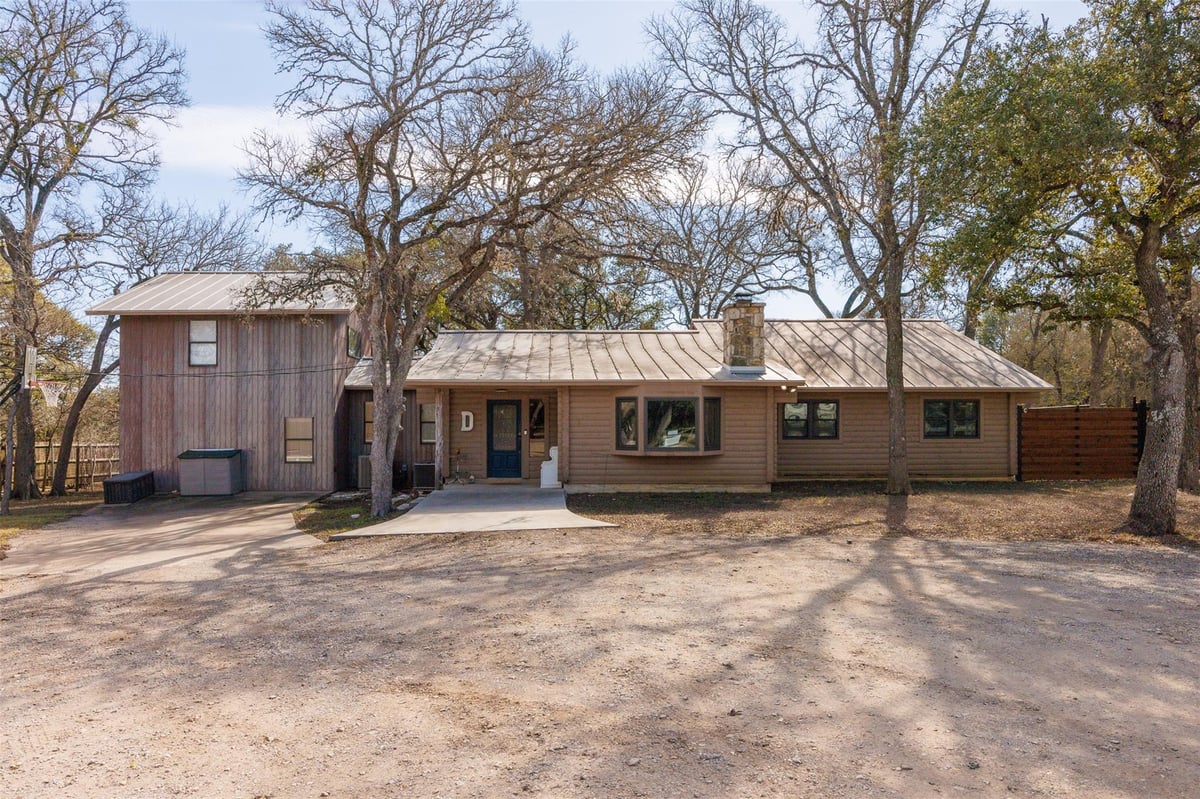 View 301 Green Acres Dr in Green Acres Sec 1 301 Green Acres Dr - front exterior - Luxury home in Green Acres Sec 1, Wimberley, TX