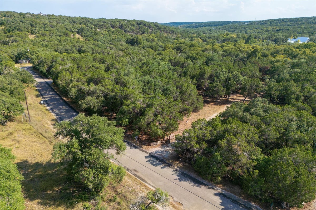 View 303 Deer Lake Rd in Deer Lake Estates 303 Deer Lake Rd - front exterior - Luxury lot in Deer Lake Estates, Wimberley, TX
