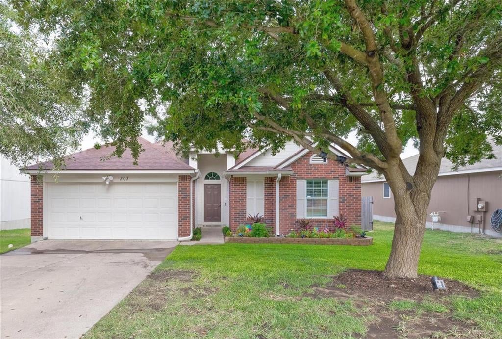 View 303 Estate DR 303 Estate DR - front exterior - Luxury home in Hutto, TX
