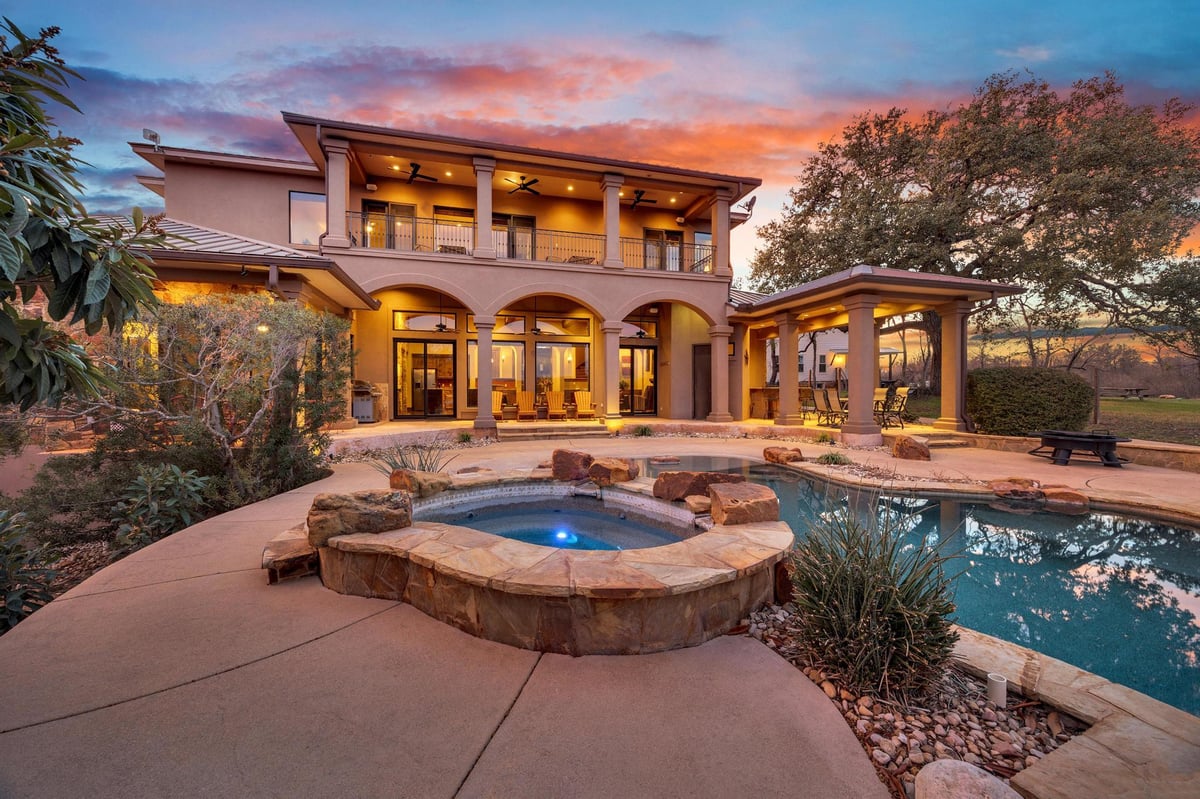 View 303 Yaupon DR in Lake Oaks Ranch 303 Yaupon DR - front exterior - Luxury home in Lake Oaks Ranch, Spicewood, TX