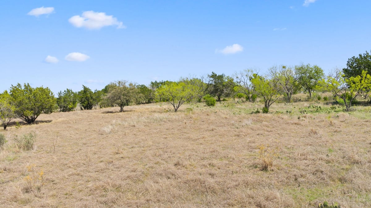Primary bedroom at 305 Running Brook Trl - Double Horn, Spicewood, TX