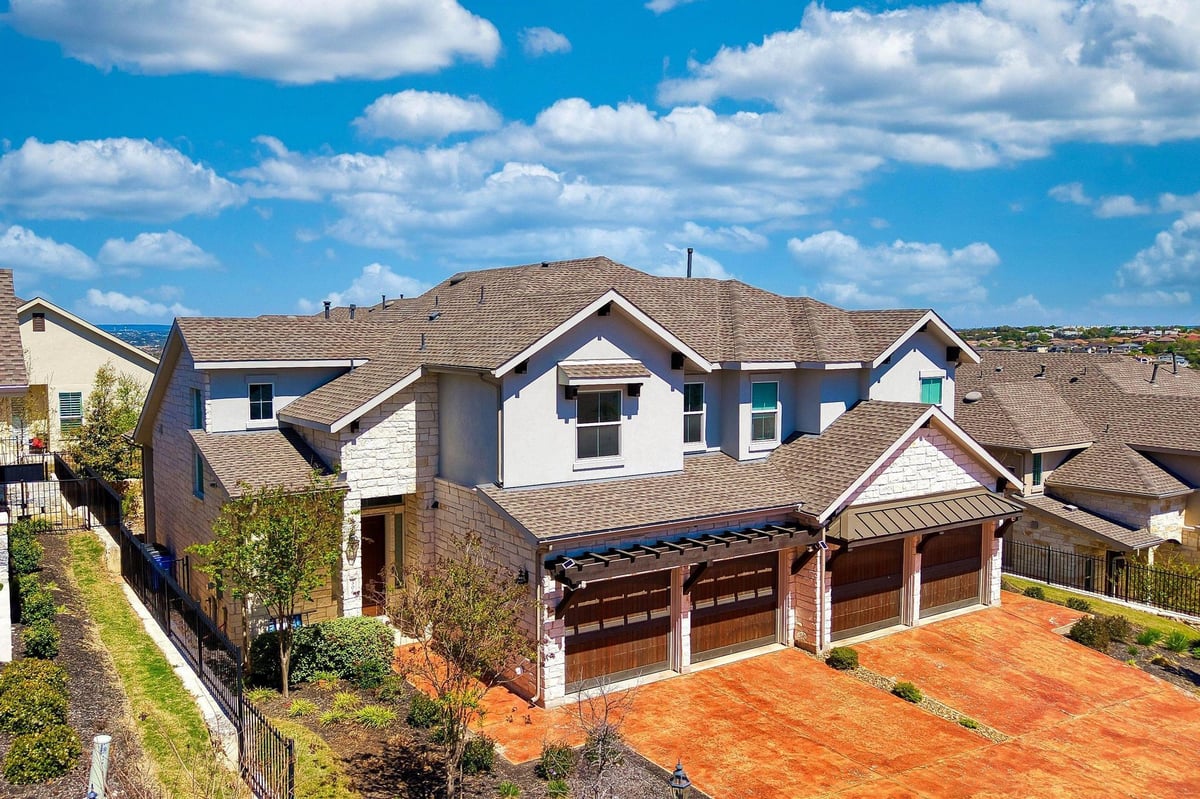 306 Cartwheel Bnd Unit #130 - front exterior - Luxury home in The Vineyards at Rough Hollow, Austin, TX