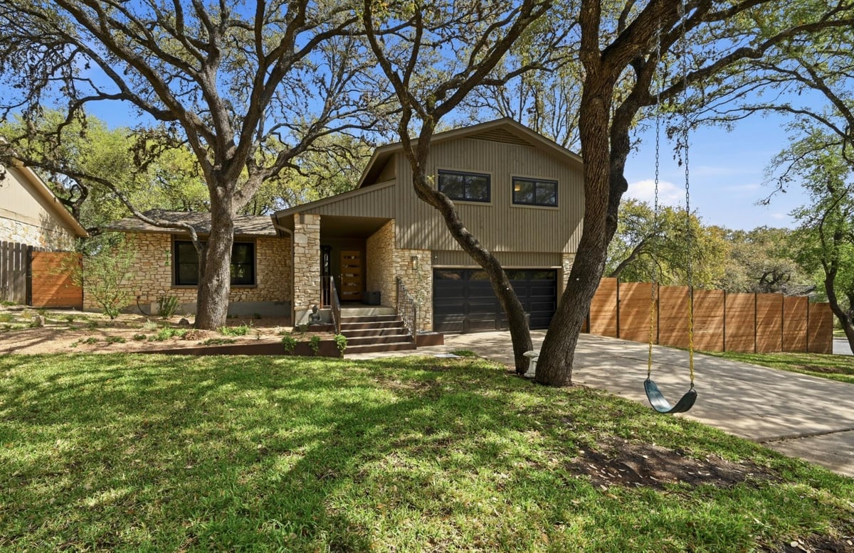 View 3100 Honey Tree Ln in Beecave Woods Sec 01 3100 Honey Tree Ln - front exterior with traditional facade - Luxury home in Beecave Woods Sec 01, Austin, TX