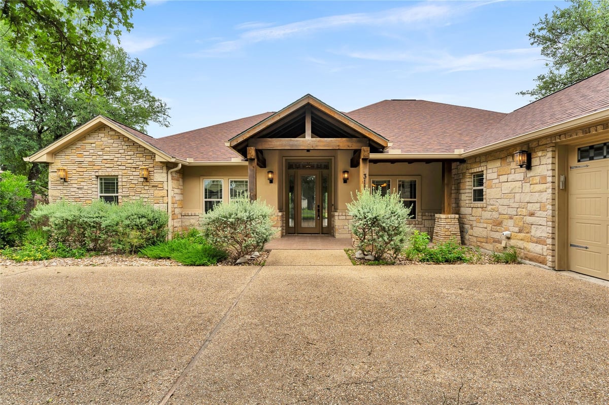 View 311 Yellow Ribbon TRL in Ranch At Delaware Creek 311 Yellow Ribbon TRL - front exterior - Luxury home in Ranch At Delaware Creek, Burnet, TX