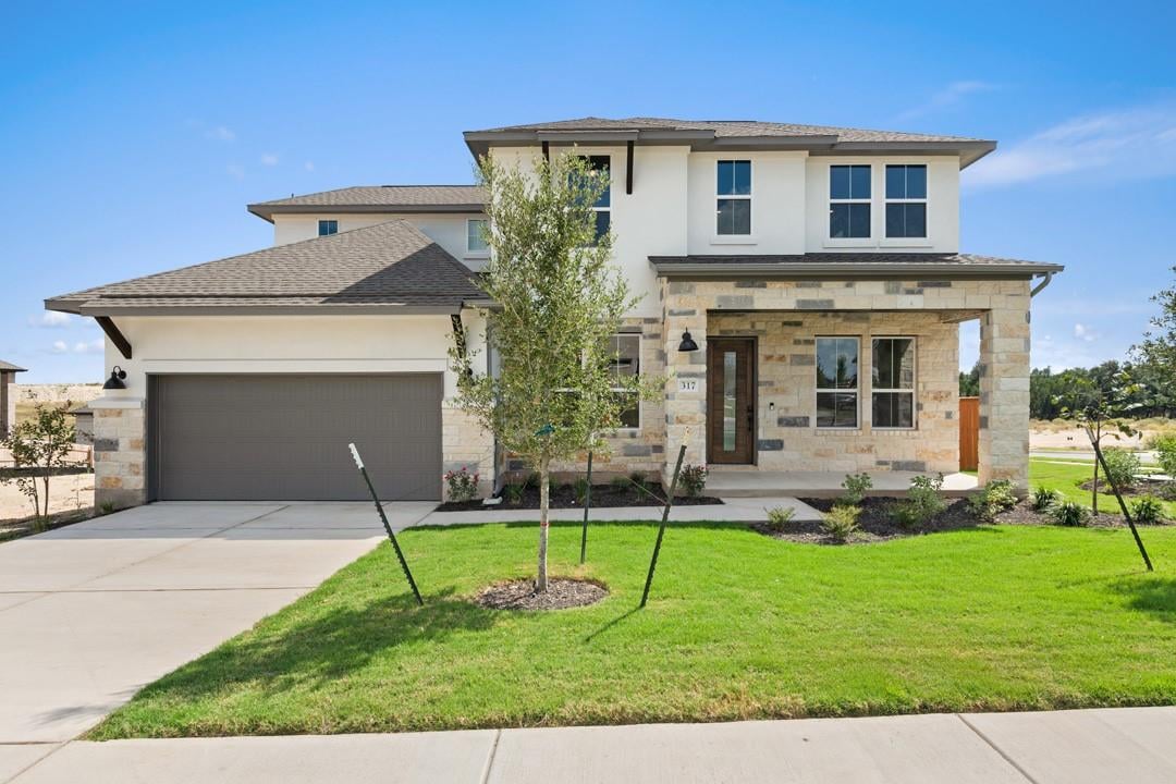 View 317 McMillian Drive in Lariat 317 McMillian Drive - front exterior - Luxury home in Lariat, Liberty Hill, TX