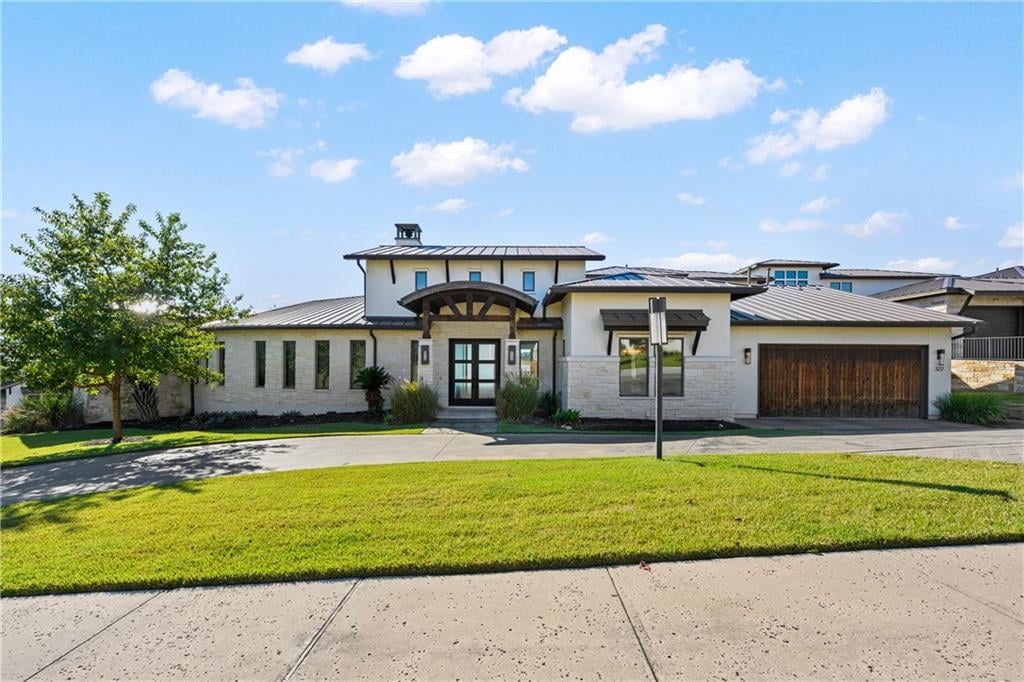 View 322 Bisset Ct in Rough Hollow Sec 01 322 Bisset Ct - front exterior - Luxury home in Rough Hollow Sec 01, Austin, TX