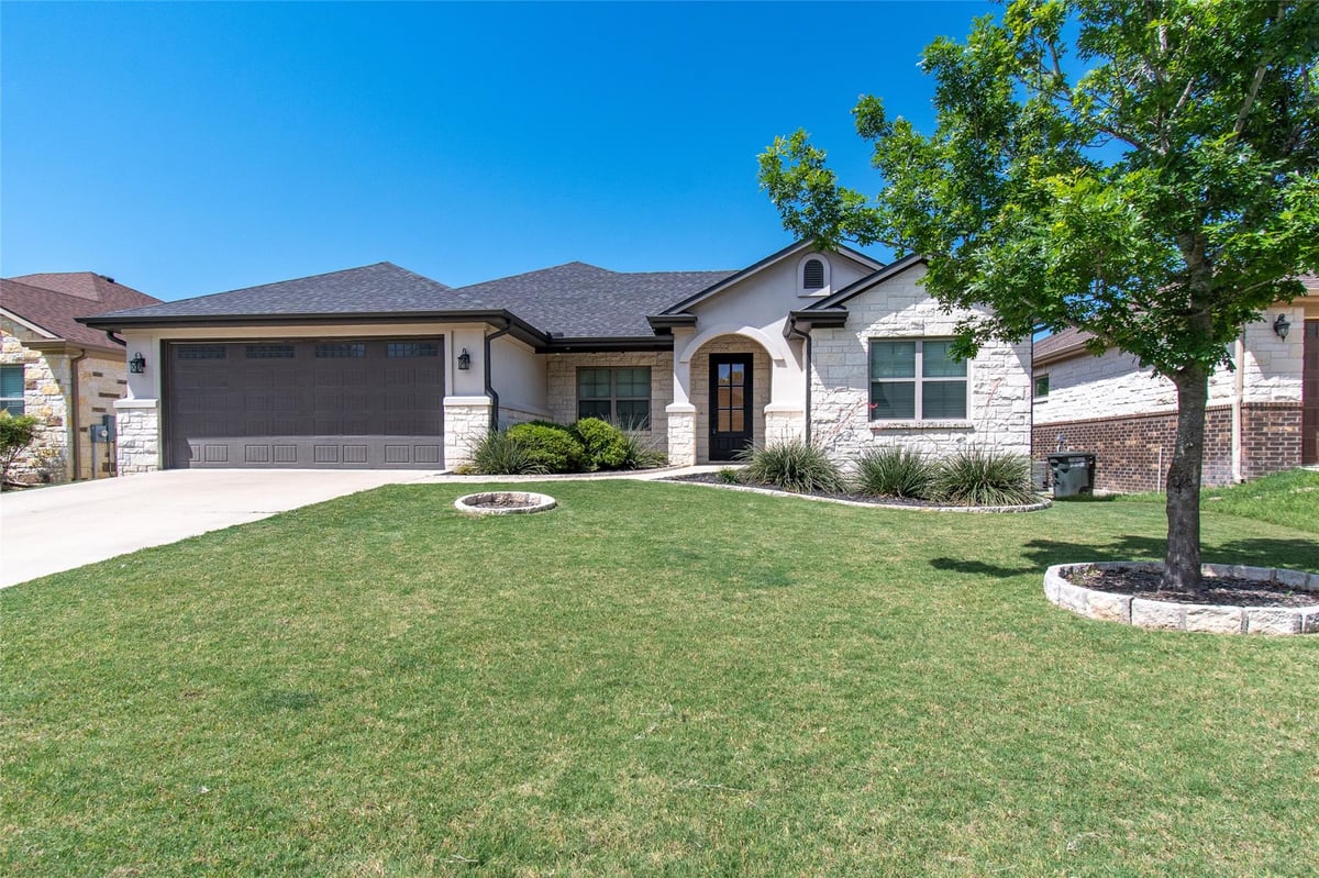 View 325 OW Lowrey DR in Mill Creek Courtyard Homes 325 OW Lowrey DR - property photo 1 - Luxury home in Mill Creek Courtyard Homes, Salado, TX