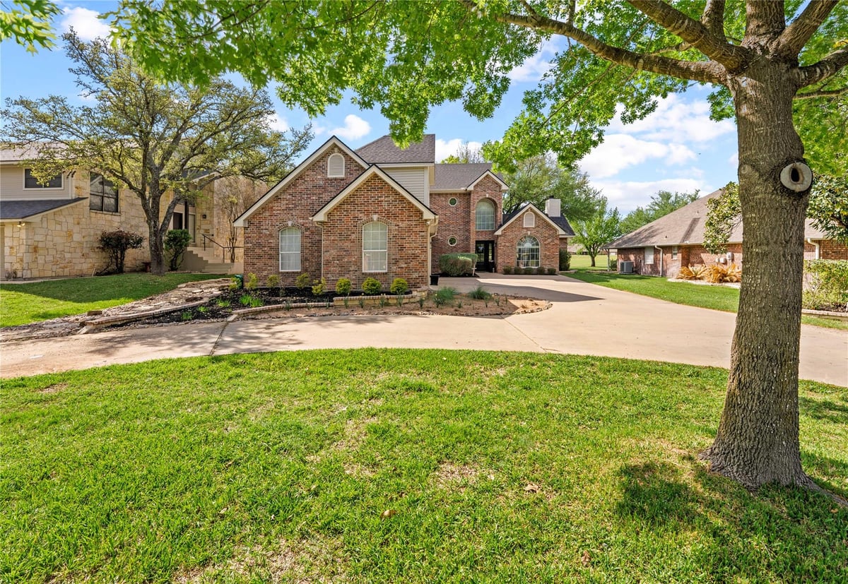 View 3401 Chisholm Trl in Lakeside At Mill Creek 3401 Chisholm Trl - front exterior - Luxury home in Lakeside At Mill Creek, Salado, TX