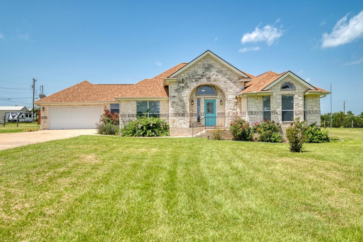 View 341 Brown RD in Knobbs Landing 341 Brown RD - front exterior - Luxury home in Knobbs Landing, McDade, TX