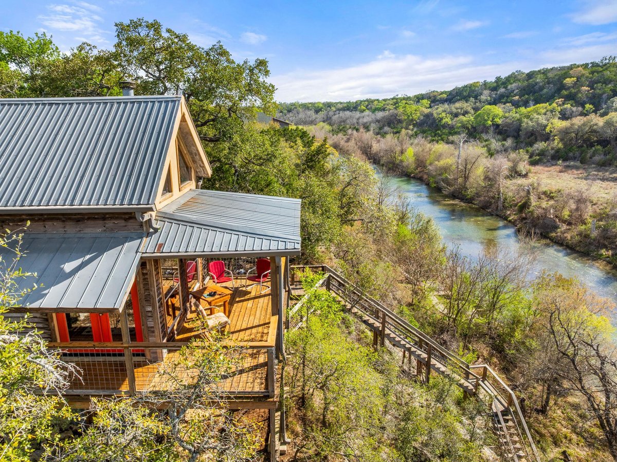 View 350 River Rapids RD in Blanco River Rapids 350 River Rapids RD - front exterior - Luxury home in Blanco River Rapids, Wimberley, TX