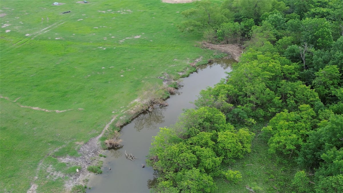 Aerial view with Hill Country pastoral views at 3501 County Road 409 - Pharrass, Taylor, TX