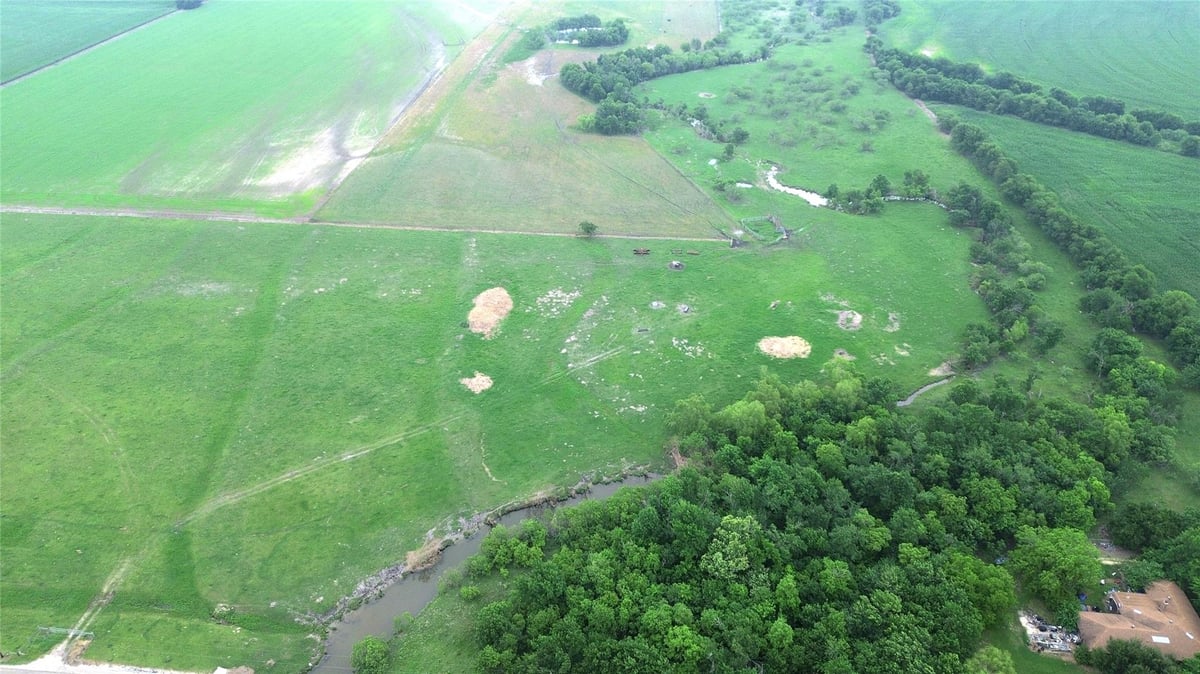 Aerial view with Rural Hill Country acreage at 3501 County Road 409 - Pharrass, Taylor, TX