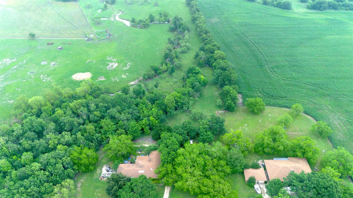 Aerial view with Hill Country pastoral views at 3501 County Road 409 - Pharrass, Taylor, TX