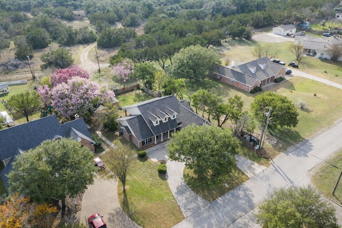 View 3900 Chisholm Trl in The Highlands Of Mill Creek SE 3900 Chisholm Trl - front exterior - Luxury home in The Highlands Of Mill Creek SE, Salado, TX
