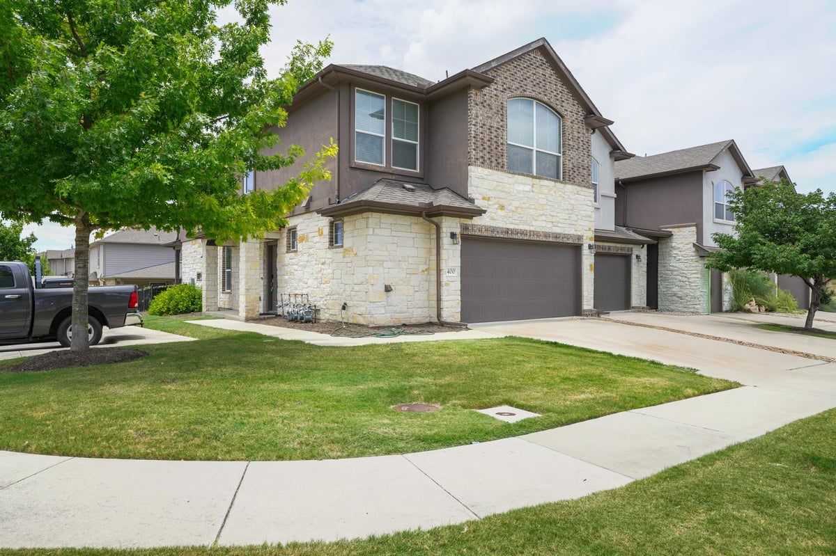 View 400 Epiphany LN in CARRINGTON COURT TOWNHOMES 400 Epiphany LN - front exterior - Luxury home in CARRINGTON COURT TOWNHOMES, Pflugerville, TX