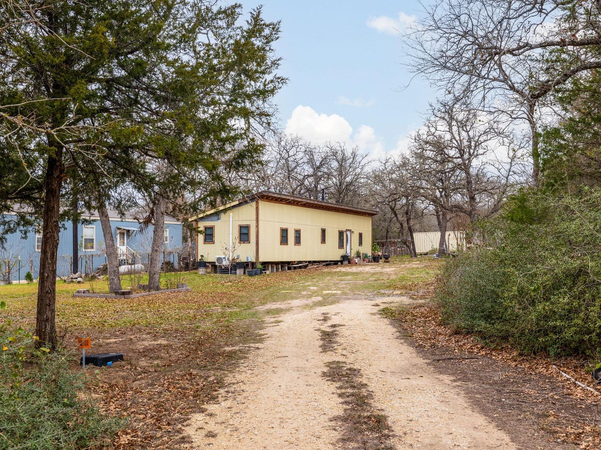 View 4001 County Rd 481 in Cooke H Sur 4001 County Rd 481 - front exterior - Luxury home in Cooke H Sur, Thrall, TX