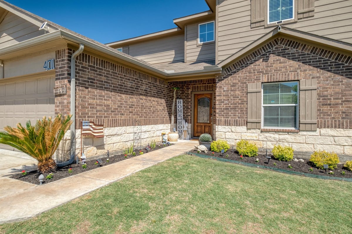 View 401 Coleto Creek Loop in Creekside Village Sec 1 & 2 401 Coleto Creek Loop - front exterior - Luxury home in Creekside Village Sec 1 & 2, Kyle, TX
