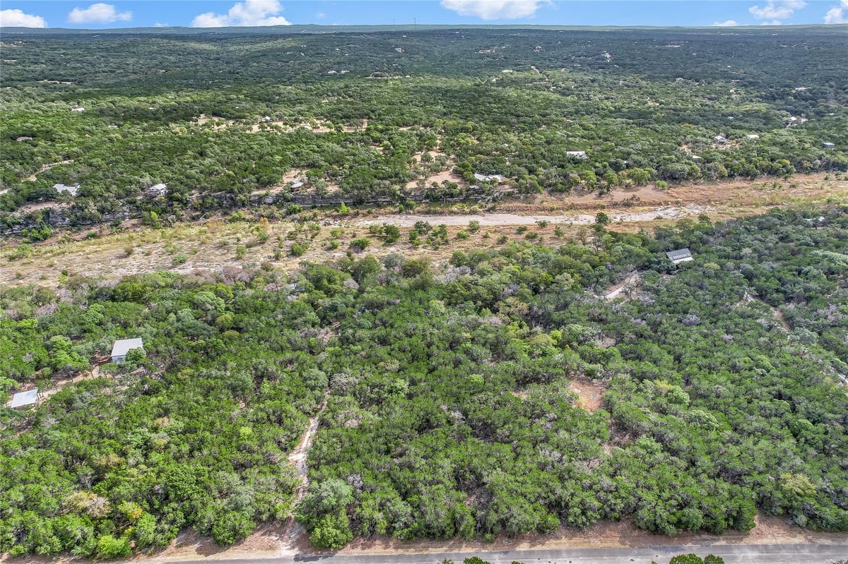 View 401 DAYS END Rd in Burnett Ranch Sec 3 401 DAYS END Rd - front exterior - Luxury lot in Burnett Ranch Sec 3, Wimberley, TX