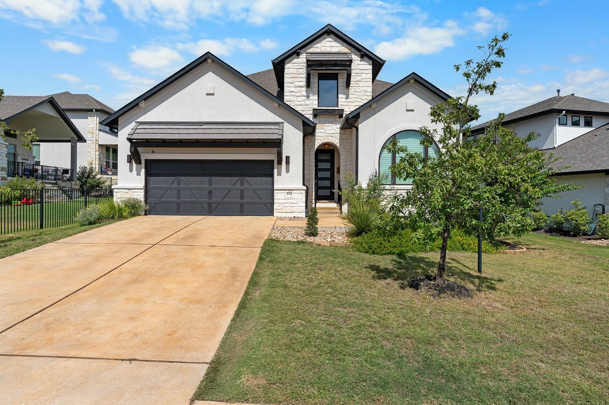 View 402 Sitlington LN in Rough Hollow 402 Sitlington LN - front exterior - Luxury home in Rough Hollow, Austin, TX