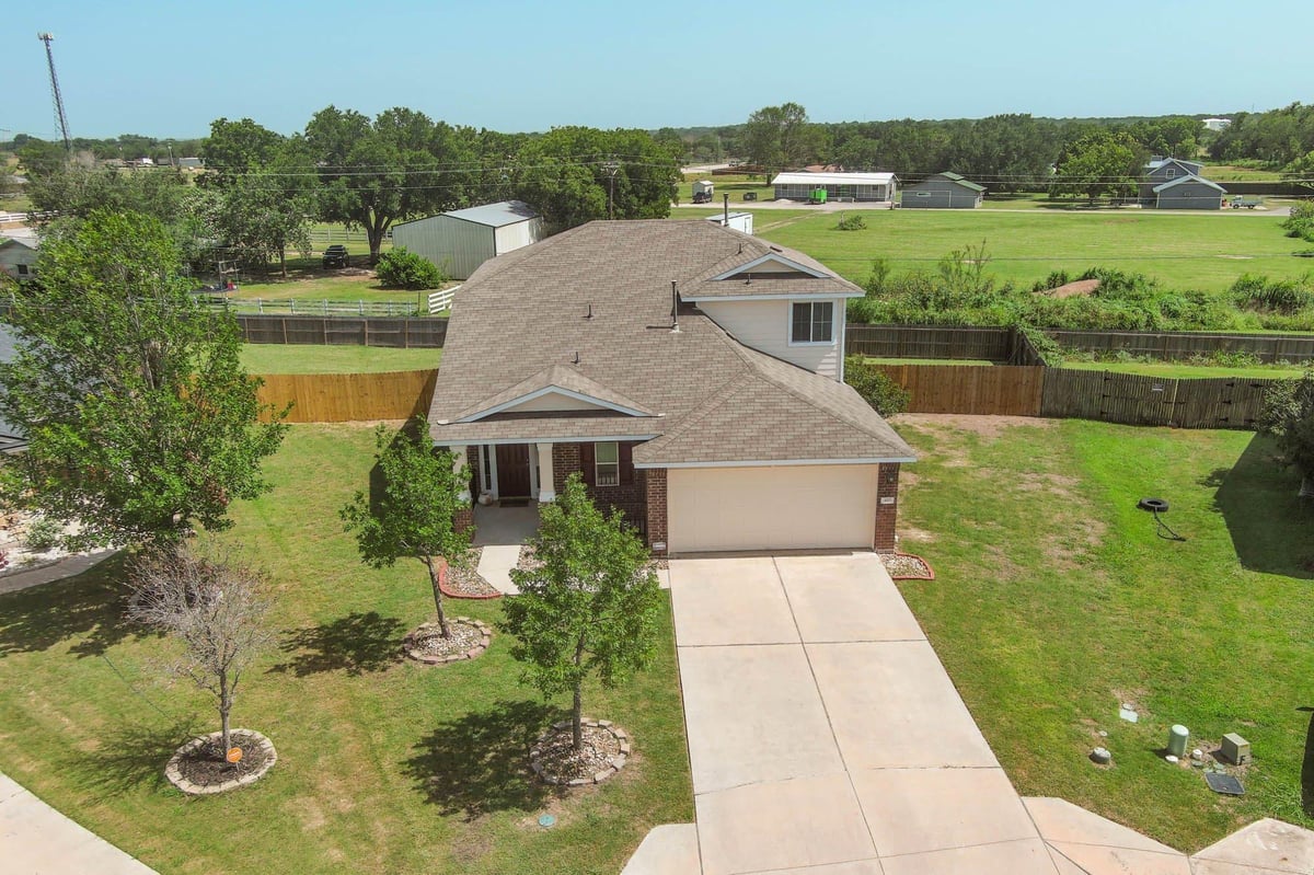 View 410 S Hunting Lodge LN in Hunters Crossing Sec Three 410 S Hunting Lodge LN - front exterior - Luxury home in Hunters Crossing Sec Three, Bastrop, TX