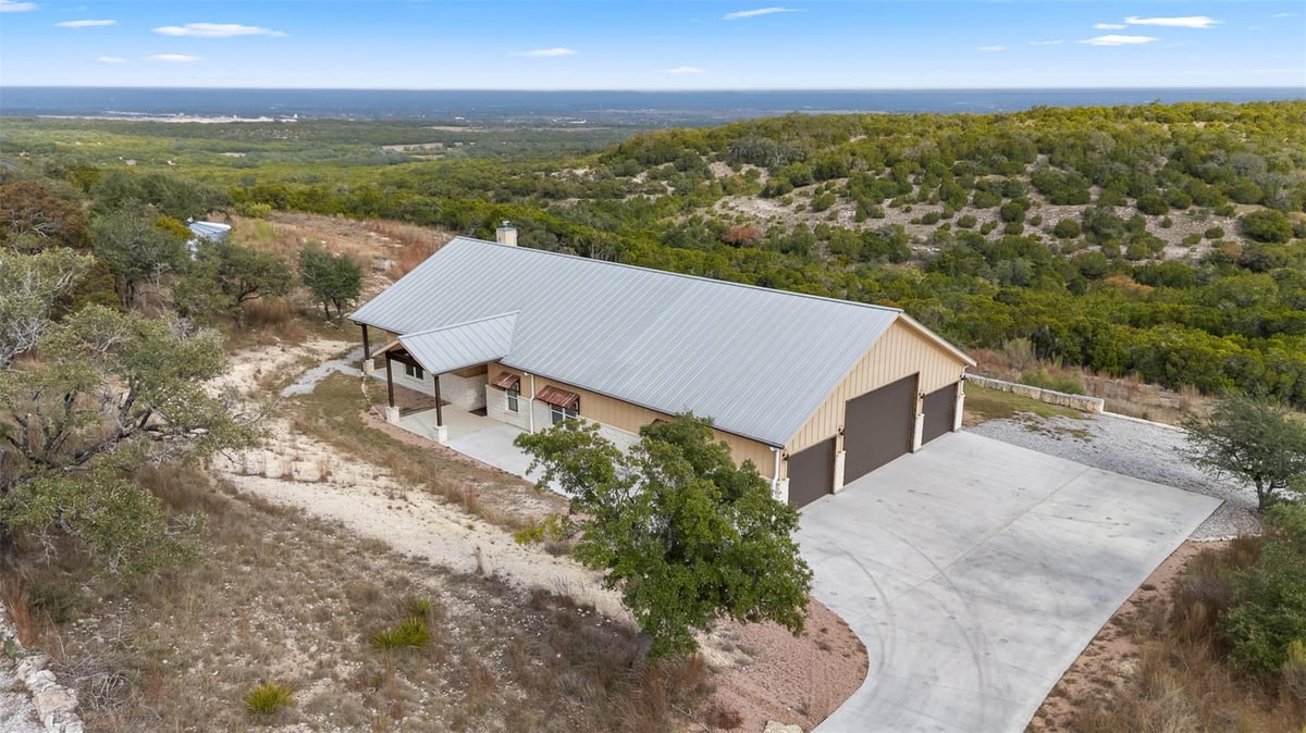 View 427 S Cedar Mountain Dr in Summit Spgs Ranch 427 S Cedar Mountain Dr - front exterior - Luxury home in Summit Spgs Ranch, Marble Falls, TX