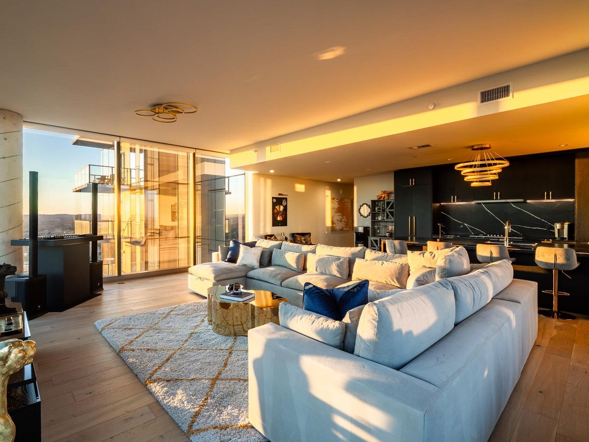 View 44 East Ave Unit #3707 in 44 East Ave Condos 44 East Ave Unit #3707 - living area with floor-to-ceiling windows - Luxury home in 44 East Ave Condos, Austin, TX