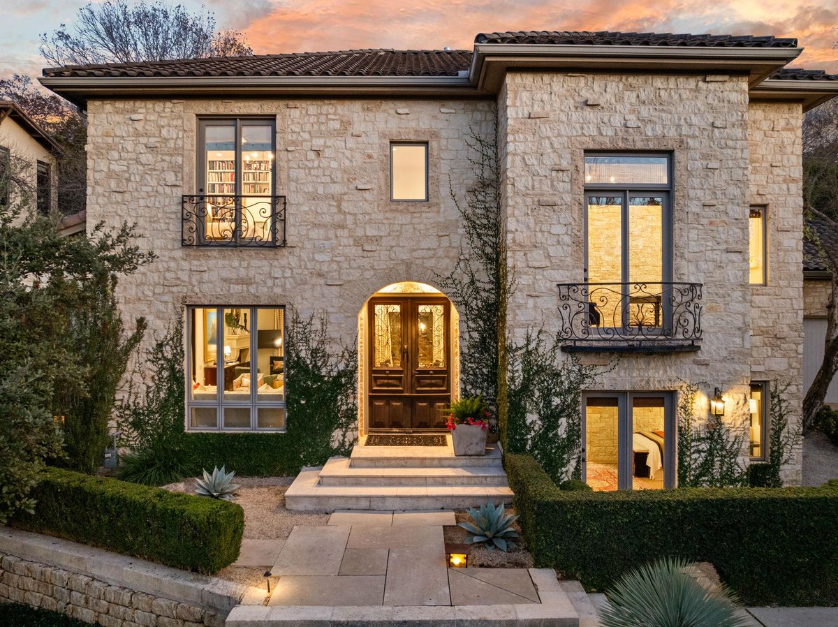 View 4407 Waterford Pl in Waterford Place Sec 02 Amd 4407 Waterford Pl - front exterior with stone urban residence and arched entry - Luxury home in Waterford Place Sec 02 Amd...