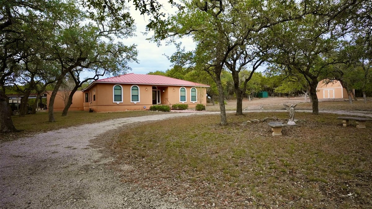 View 450 Windmill Oaks DR in River Oaks Of Wimberley Unit 2 450 Windmill Oaks DR - front exterior - Luxury home in River Oaks Of Wimberley Unit 2, Wimberley, TX