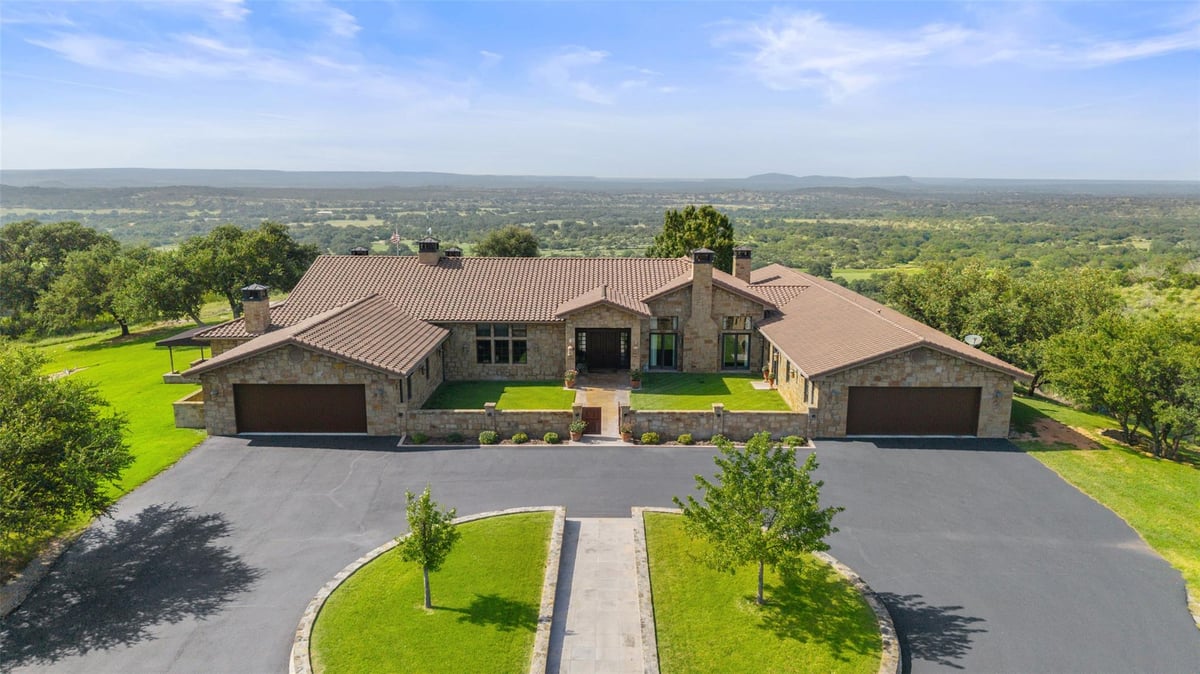 Aerial view with Hill Country views at 4529 Ranch Road 3347 - 5 bed 4 bath home