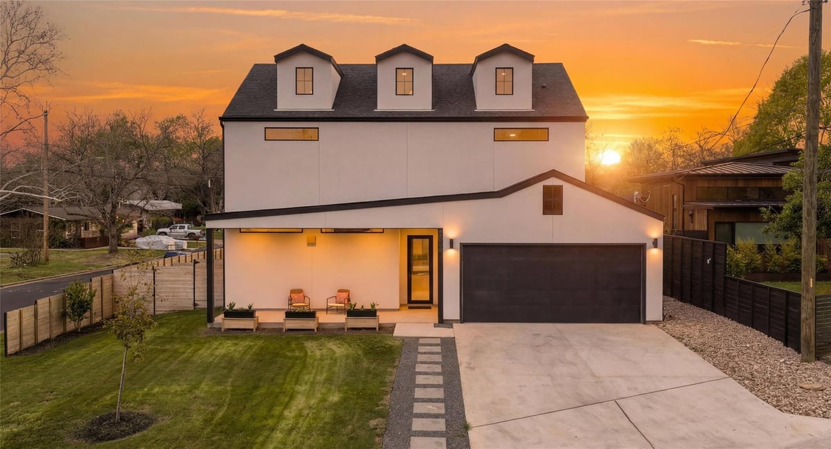 View 4706 Richmond Ave in Greenwood Forest Sec 02 4706 Richmond Ave - front exterior with sunset modern farmhouse facade - Luxury home in Greenwood Forest Sec 02, Austin, TX