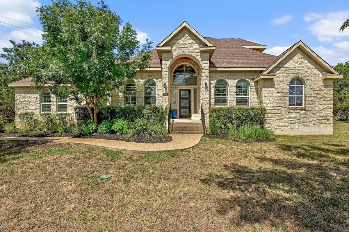 View 501 Flamingo Blvd in Lakeway Sec 11 501 Flamingo Blvd - front exterior - Luxury home in Lakeway Sec 11, Lakeway, TX