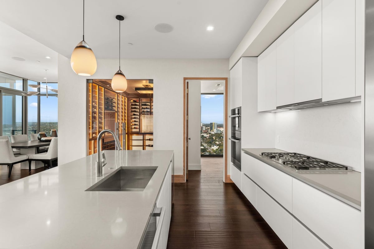 View 501 West Ave Unit #3602 in Fifth & West Residences 501 West Ave Unit #3602 - gourmet kitchen with sleek white cabinetry - Luxury home in Fifth & West Residences, Austin, TX