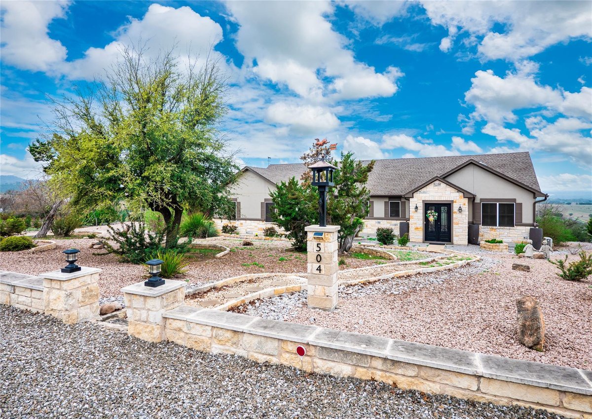 View 504 Cedar Mountain Dr in Summit Spgs 504 Cedar Mountain Dr - front exterior - Luxury home in Summit Spgs, Marble Falls, TX