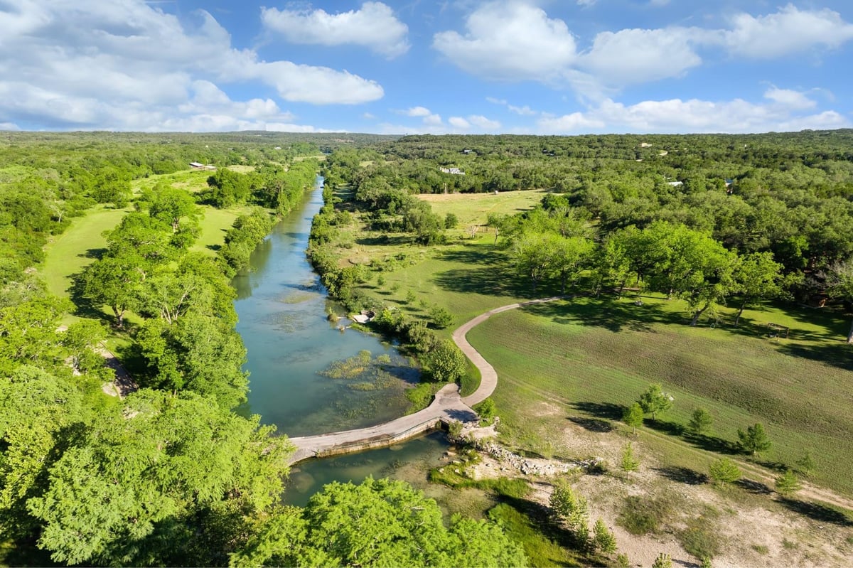 View 5055 Wayside Dr in None 5055 Wayside Dr - aerial view with Hill Country river views - Luxury home in None, Wimberley, TX