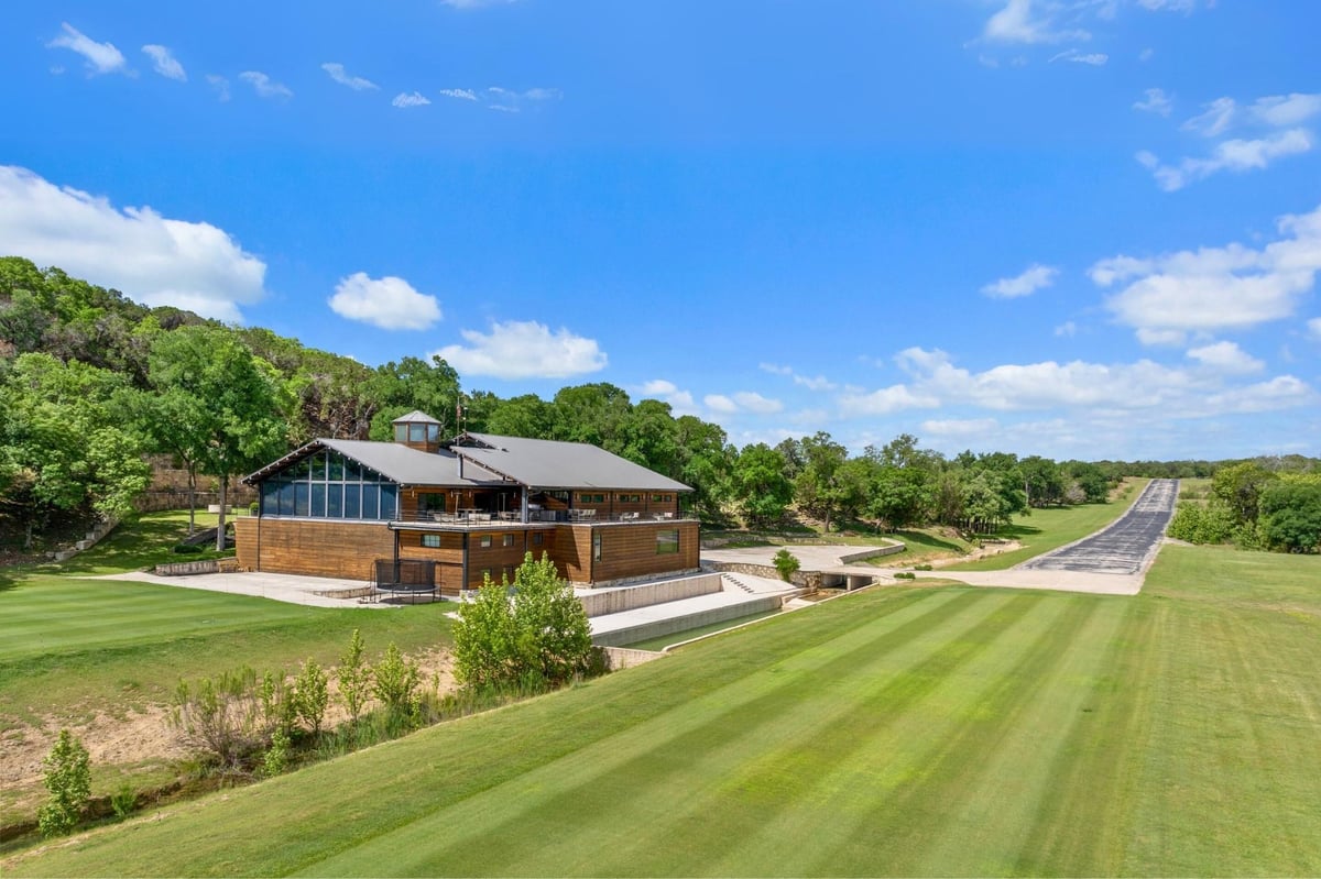 Front exterior with Modern architectural design with wood si at 5055 Wayside Dr - None, Wimberley, TX