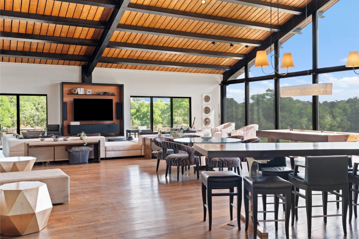 Living area with Floor-to-ceiling glass walls with Hill C at 5055 Wayside Dr - None, Wimberley, TX