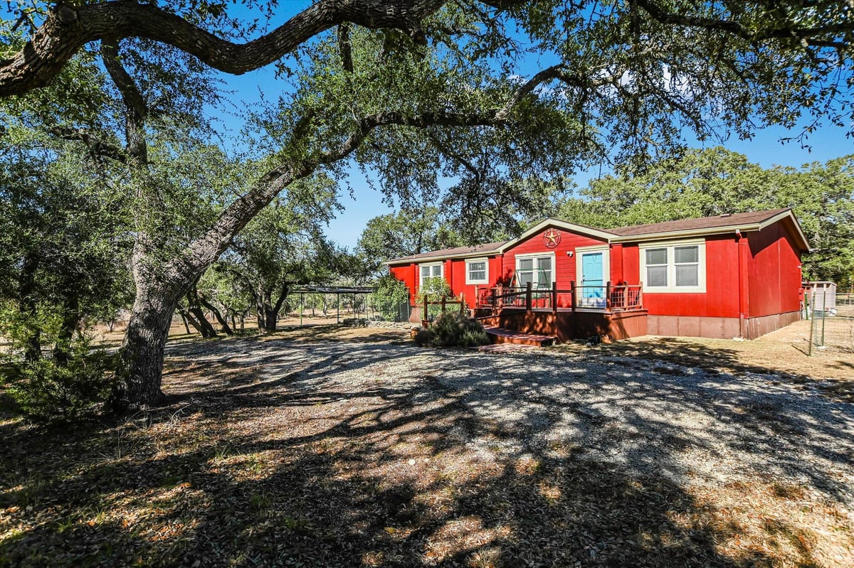 View 5300 Fischer Store Rd in Spring Hollow 5300 Fischer Store Rd - property photo 1 - Luxury home in Spring Hollow, Wimberley, TX