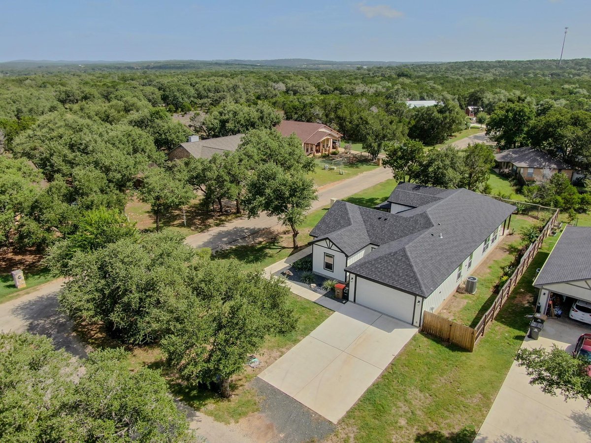 View 54 Persimmon Dr in WOODCREEK 54 Persimmon Dr - property photo 1 - Luxury home in WOODCREEK, Wimberley, TX
