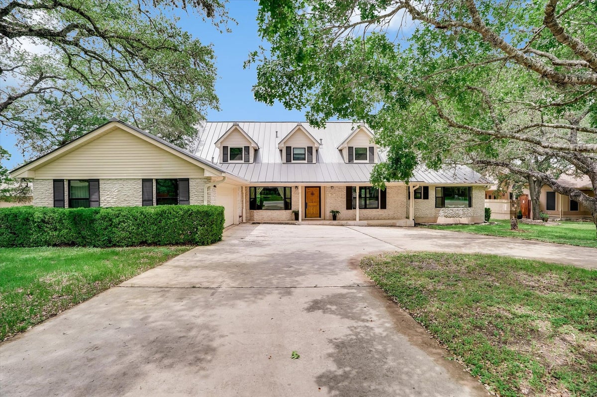 View 56 Woodcreek Dr in Woodcreek Sec 2 56 Woodcreek Dr - front exterior - Luxury home in Woodcreek Sec 2, Wimberley, TX