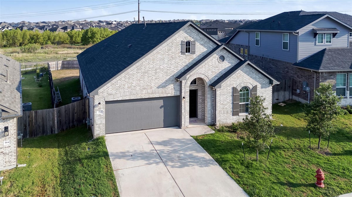 View 574 Sugar Cane Rd in Sunfield Ph Five Sec Four 574 Sugar Cane Rd - front exterior - Luxury home in Sunfield Ph Five Sec Four, Buda, TX