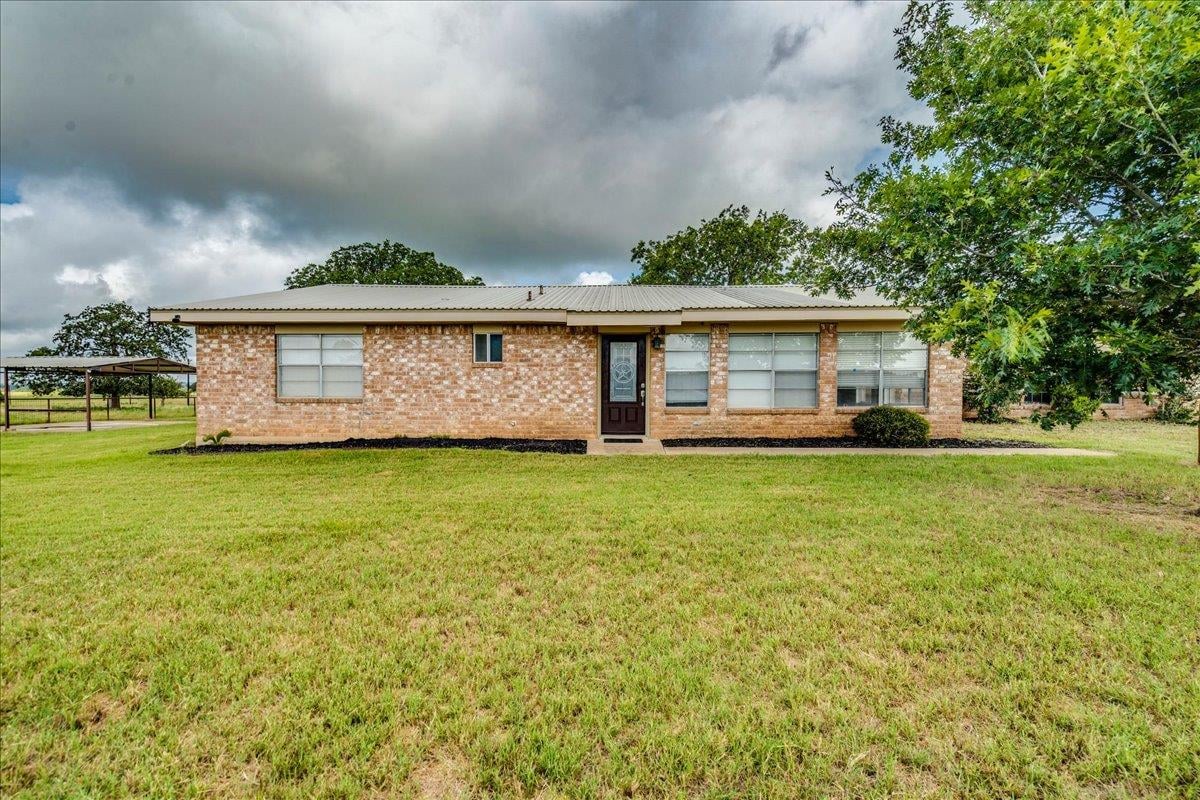 View 595 Cardinal RD in CLEMENTINE RANCH 595 Cardinal RD - front exterior - Luxury home in CLEMENTINE RANCH, Rosanky, TX