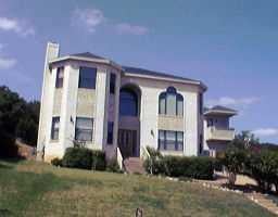 5956 Cape Coral - front exterior - Luxury home in HILLS OF LOST CREEK SEC 8 TH, Austin, TX