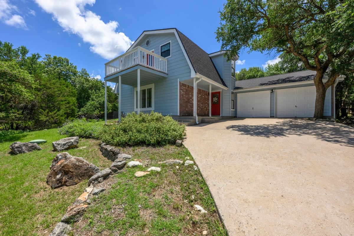 View 6 Basswood CIR in Woodcreek Sec 20 6 Basswood CIR - property photo 1 - Luxury home in Woodcreek Sec 20, Wimberley, TX