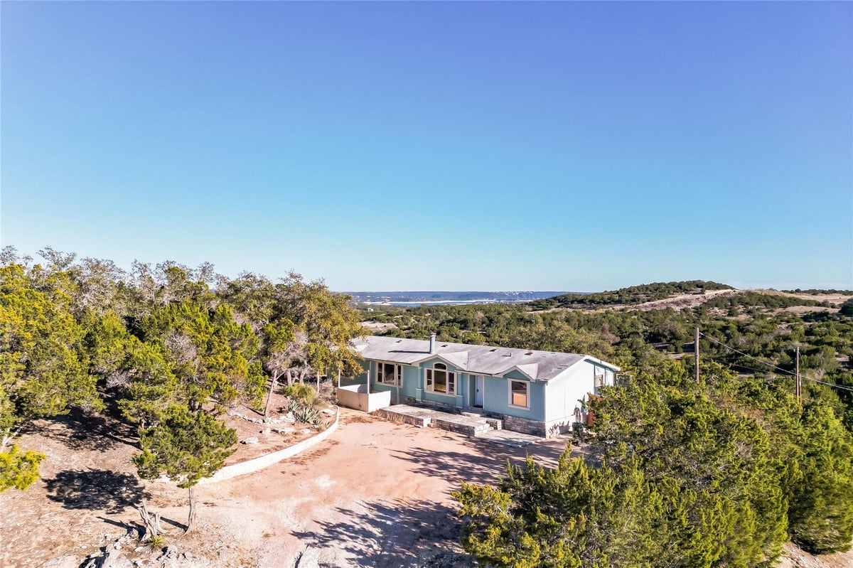 View 6000 La Paloma Ln in Lago Ranchos Sec 01 6000 La Paloma Ln - front exterior - Luxury home in Lago Ranchos Sec 01, Lago Vista, TX