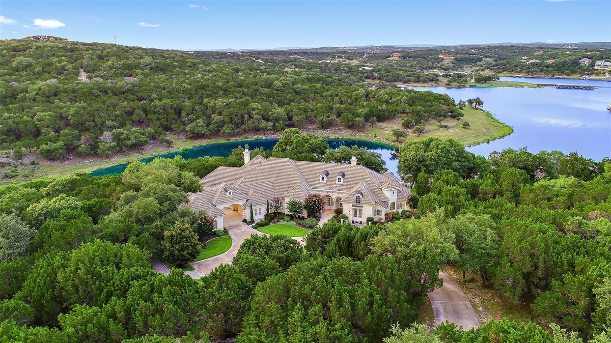 View 601 S Angel Light Dr in La Isla At Angel Bay 601 S Angel Light Dr - front exterior - Luxury home in La Isla At Angel Bay, Spicewood, TX