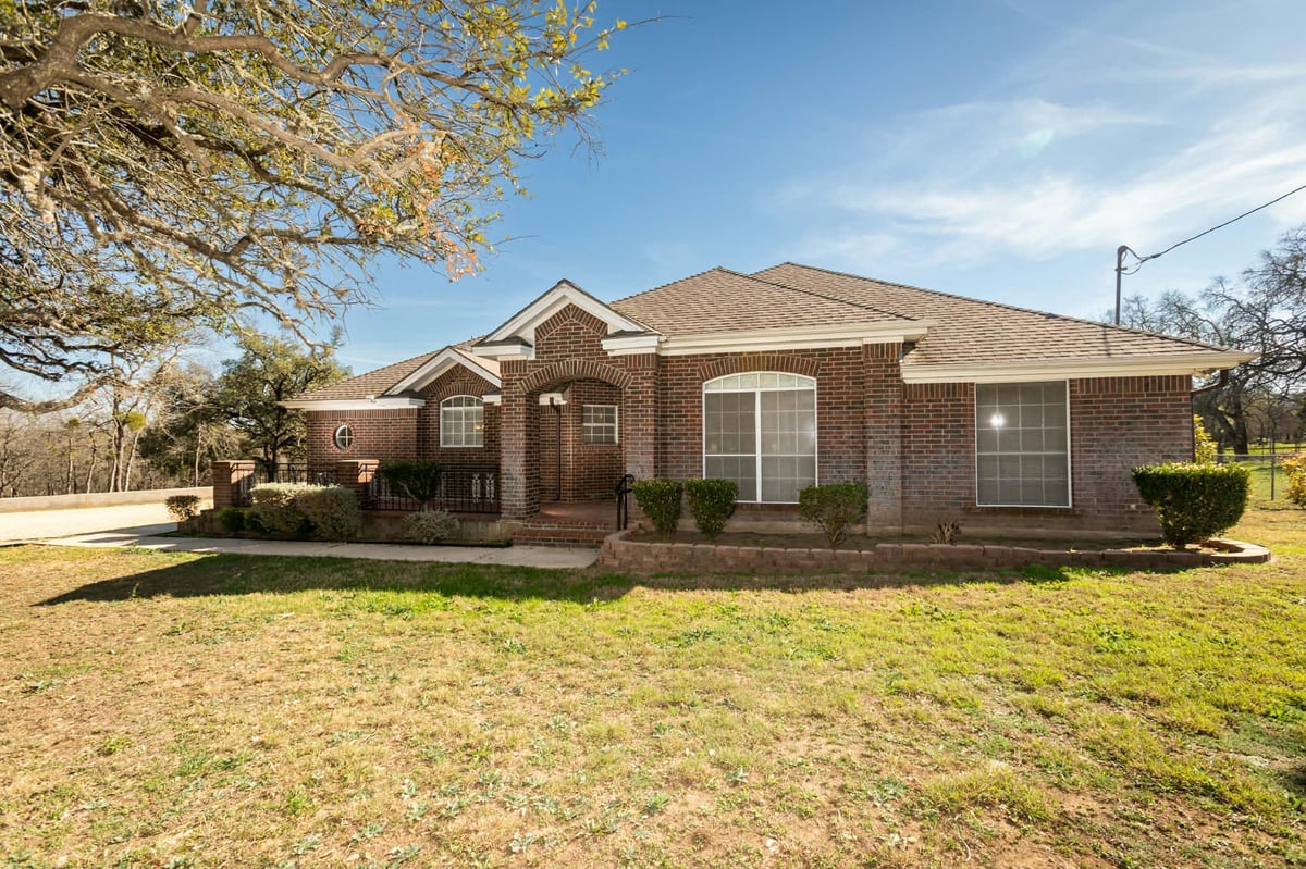 View 603 Oakwood DR in Hays Country Oaks Sec 1 603 Oakwood DR - front exterior - Luxury home in Hays Country Oaks Sec 1, Buda, TX