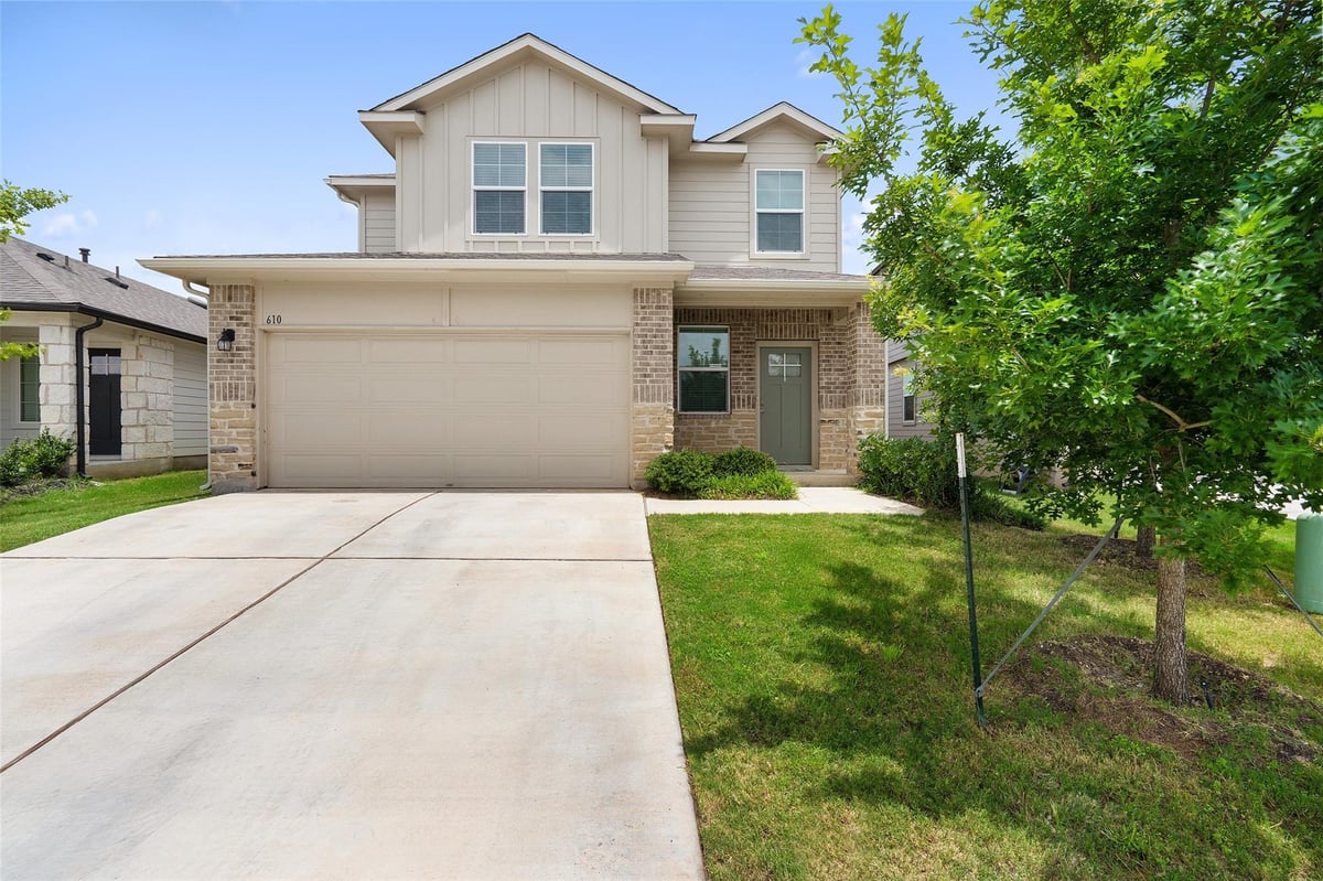 View 610 Roaring Fork LN in RIVER'S BEND AT PECAN PARK 610 Roaring Fork LN - front exterior - Luxury home in RIVER'S BEND AT PECAN PARK, Bastrop, TX