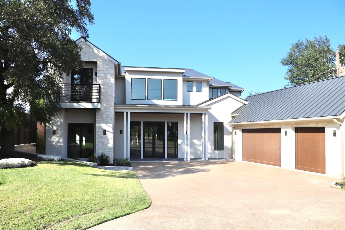 View 6102 Forest Hills Dr in Knollwood A 6102 Forest Hills Dr - front exterior with 6102 Forest Hills Dr in Austin - Luxury home in Knollwood A, Austin, TX
