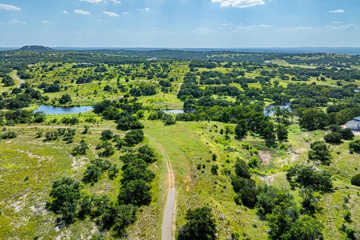 View 613 Cattle Creek Rd in The Preserve at Walnut Springs 613 Cattle Creek Rd - front exterior - Luxury lot in The Preserve at Walnut Springs, Johnson City, TX