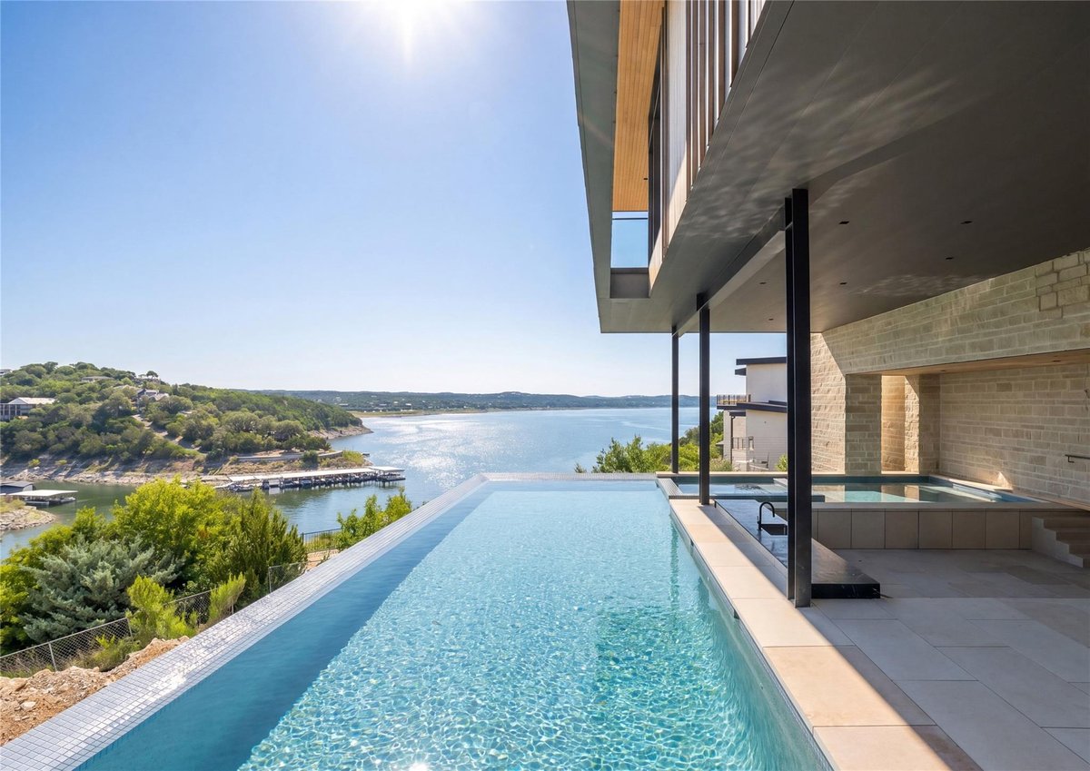 View 629 Casasanta TRL in Rough Hollow The Peninsula 629 Casasanta TRL - front exterior - Luxury home in Rough Hollow The Peninsula, Austin, TX